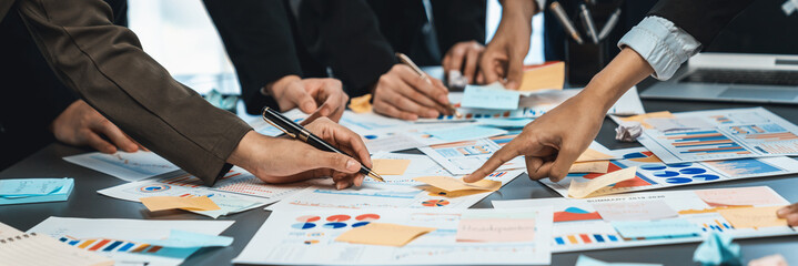 Analyst team use sticky note for financial insight with business Fintech papers for data analysis dashboard. Creative and analytic teamwork idea brainstorming for strategic business marketing. Prodigy