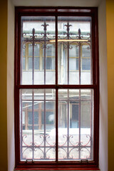 window with a red wood frame