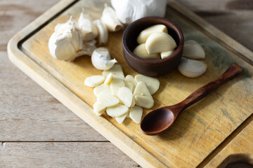 Seasoned Garlic and Herbs for Delicious Home Cooking. Fresh garlic and a variety of aromatic herbs...
