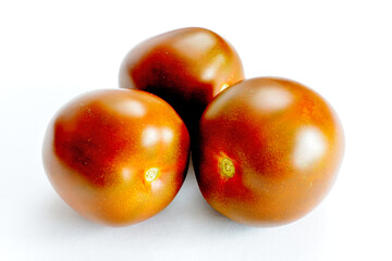 group of garden tomatoes isolated on white background, close up  