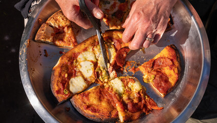 Pizza Being Cut  