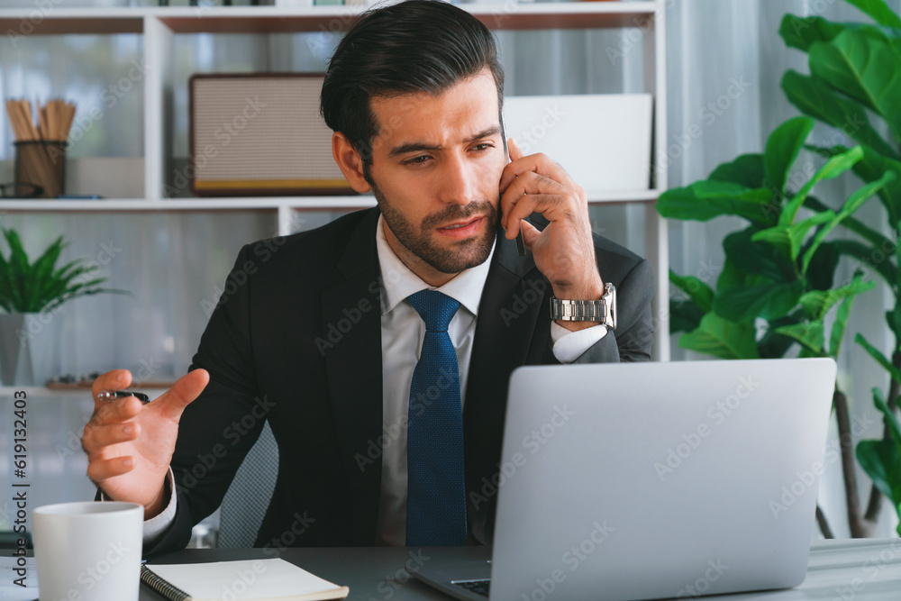 Aufkleber diligent businessman busy talking on the phone call with clients while working with laptop in his of