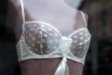 closeup of white bra underwear on mannequin in fashion store for women - obrazy, fototapety, plakaty
