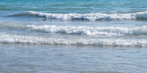 Sea waves run on the shore of the sea or ocean. Beautiful relaxing view on vacation.