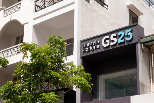 Ho Chi Minh City, Vietnam - June 4, 2023: Blue and black commercial sign with GS25 logo on a convenience store. Advertisement outside a grocery store of a popular Korean brand on a sunny day