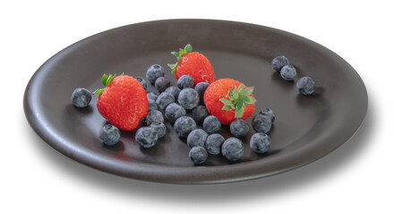 Strawberries and Cranberries on a black plate