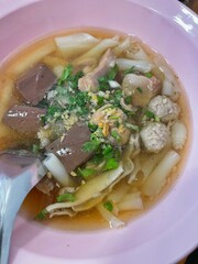 pig blood curd soup with minced pork, pig's organs and ivy gourd leaves served with customized dipping sauce and rice