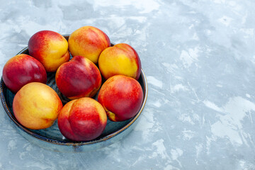 front view fresh peaches delicious summer fruits on light white desk fresh fruits mellow vitamine ripe tree