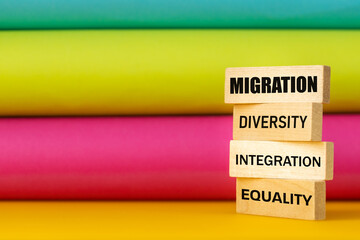 Words migration, diversity, integration and equality on wooden blocks, beautiful multicolored background, concept, international solidarity against exclusion, Helping expats to start a new life - obrazy, fototapety, plakaty