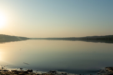 Fototapeta premium View of the panorama of a large lake early in the morning