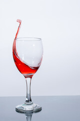 A beautiful splash of red wine in a glass