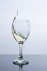 Beautiful splash of white wine in a glass
