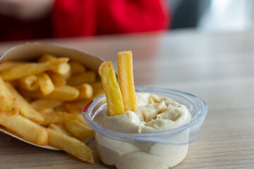 Juicy, delicious French fries and garlic sauce