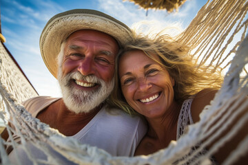 Couple on holiday, resting on a hammock.
