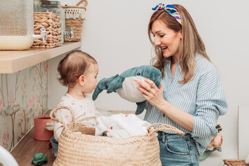 Mom showing her daughter stuffed shark toy