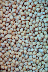 closeup the bunch ripe white gram grains in the wooden basket soft focus natural brown background.