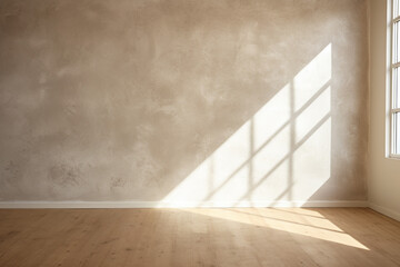 room with beige plaster wall and light wooden floors with light and shadow from the window
