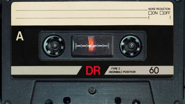audio cassette plays in tape deck