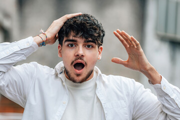 boy in the street with an expression of surprise or astonishment