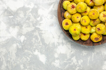 top view fresh sweet figs inside brown plate on light-white desk tree plant fruits fresh mellow taste