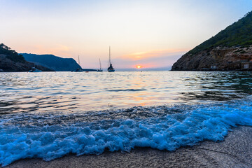 Beautiful sunset at Benirras beach in Ibiza in Spain