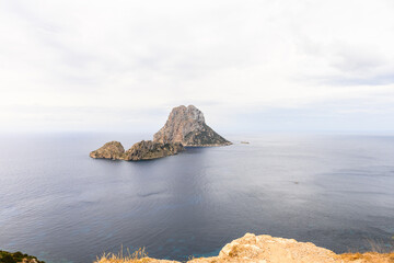Ibiza landmark Es Vedra on a cloudy day seen from Mirador des Vedra viewpoint