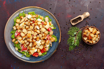 top view tasty caesar salad with little rusks on dark desk salad food meal lunch vegetables