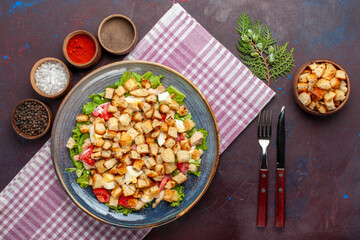 top view tasty caesar salad with rusks and seasonings on the dark desk salad food meal lunch vegetables