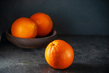 front view fresh juicy oranges on dark background citrus fruit juice color photo tangerine exotic tropical