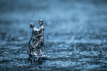 romantic couple dancing in the rain