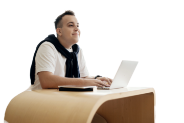 Student guy happy school year, uses laptop on desk in class during college lesson. Transparent background, png.