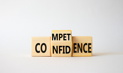 Competence and Confidence symbol. Wooden cubes with words Confidence and Competence. Beautiful white background. Business concept. Copy space