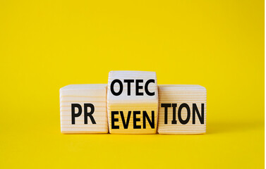 Protection and Prevention symbol. Wooden cubes with words Prevention and Protection. Beautiful yellow background. Business concept. Copy space