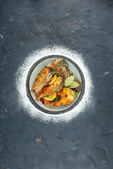 top view fried fish slices with lemon slices on a dark background seafood color salad food meat ocean health meal