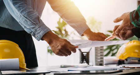 Architect having a meeting with construction team on site