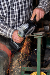 A ferrer working on a horse shoe