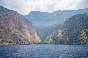 View from water of Butterfly Valley in Oludeniz Fethiye in the morning, Turkey