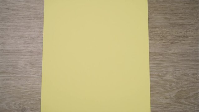 Open red envelope with blank sheet of paper. Stop motion animation