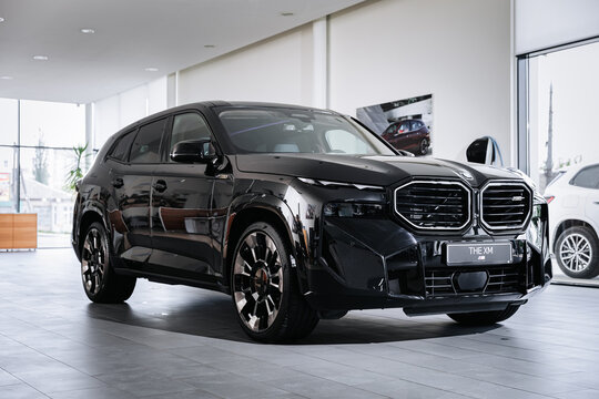 Vinnitsya, Ukraine - May 18, 2023 : BMW XM - Luxury car fully electric edrive technology in plug-in hybrid system presentation in showroom - side view