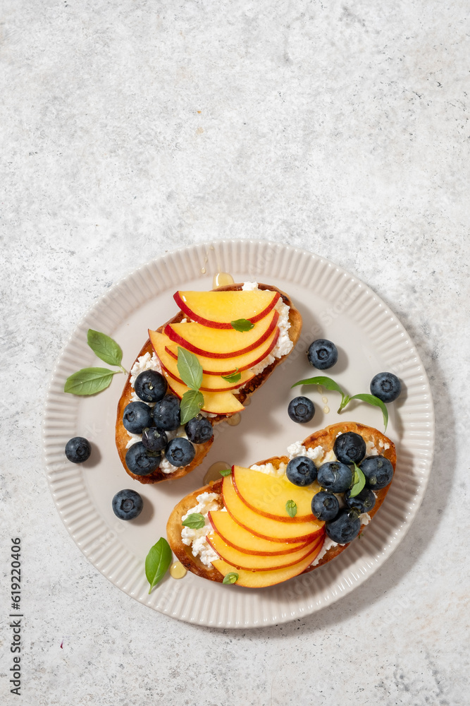Wall mural Toast bread with blueberry, peach, cheese, basil leaf - Wall murals