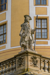 Obraz premium Baroque stone soldier statue with hunting dog at Moritzburg castle