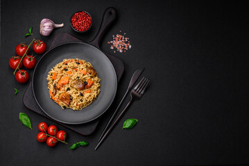 Delicious fresh pilaf with rice, carrots, meat, onions, spices and berries
