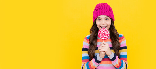 cheerful teen girl eating lollipop candy. Teenager child with sweets, poster banner header, copy...