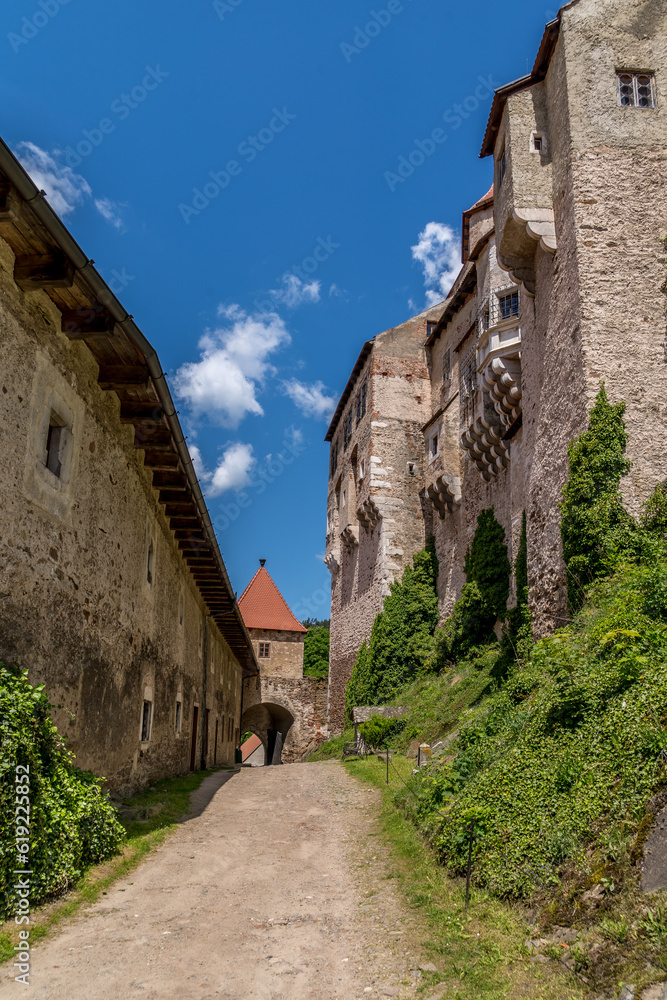 Wall mural pernstejn castle inner courtyard with cloudy blue sky