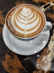 Coffee. Cup of coffee on a marble surface. Foam coffee