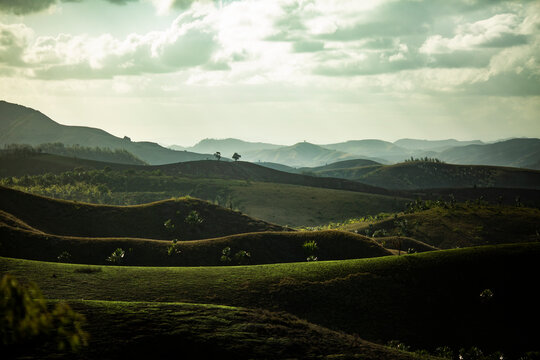 Mountainous ridges with green terrains and blue sky
