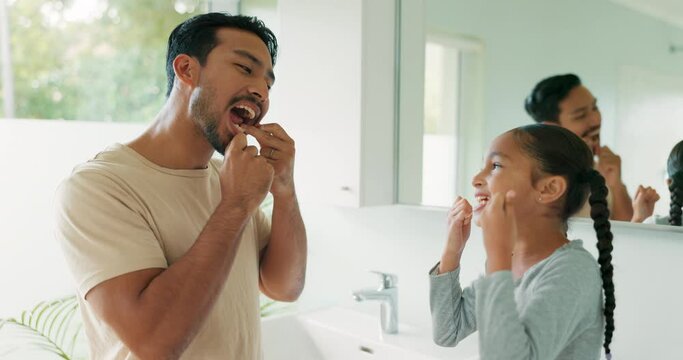 Dad, girl with floss and cleaning teeth with string or help in dental wellness, healthcare and teaching hygiene in bathroom. Father, child learning and healthy tooth care routine and kid in morning