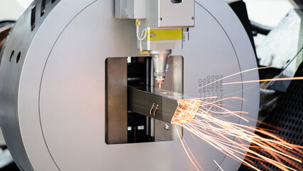 lose up scene the fiber laser cutting machine cutting  machine cut the stainless steel tube. The...