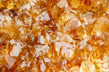 heated amethyst (citrine) crystal. macro detail texture background. close-up raw rough unpolished...