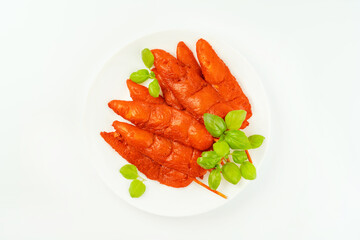 Fresh raw marinated chicken meat skewers iner fillet on a white background.Top view.Copy space.Closeup of chicken meat.Chicken breast inner Fillets.Marinated Chicken skewers fillet meat.